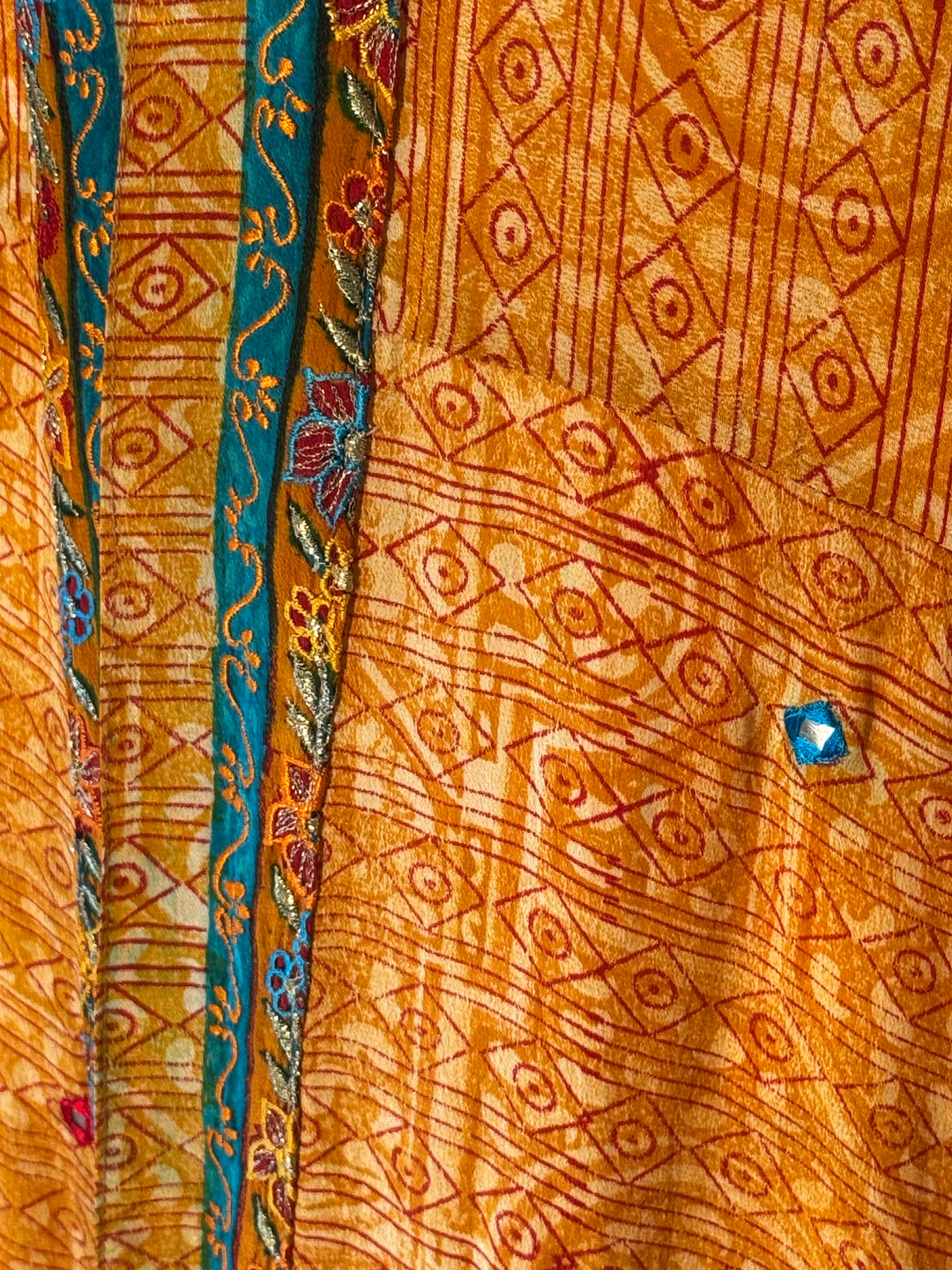 Orange with red vintage silk print and delicate colorful embroidery 