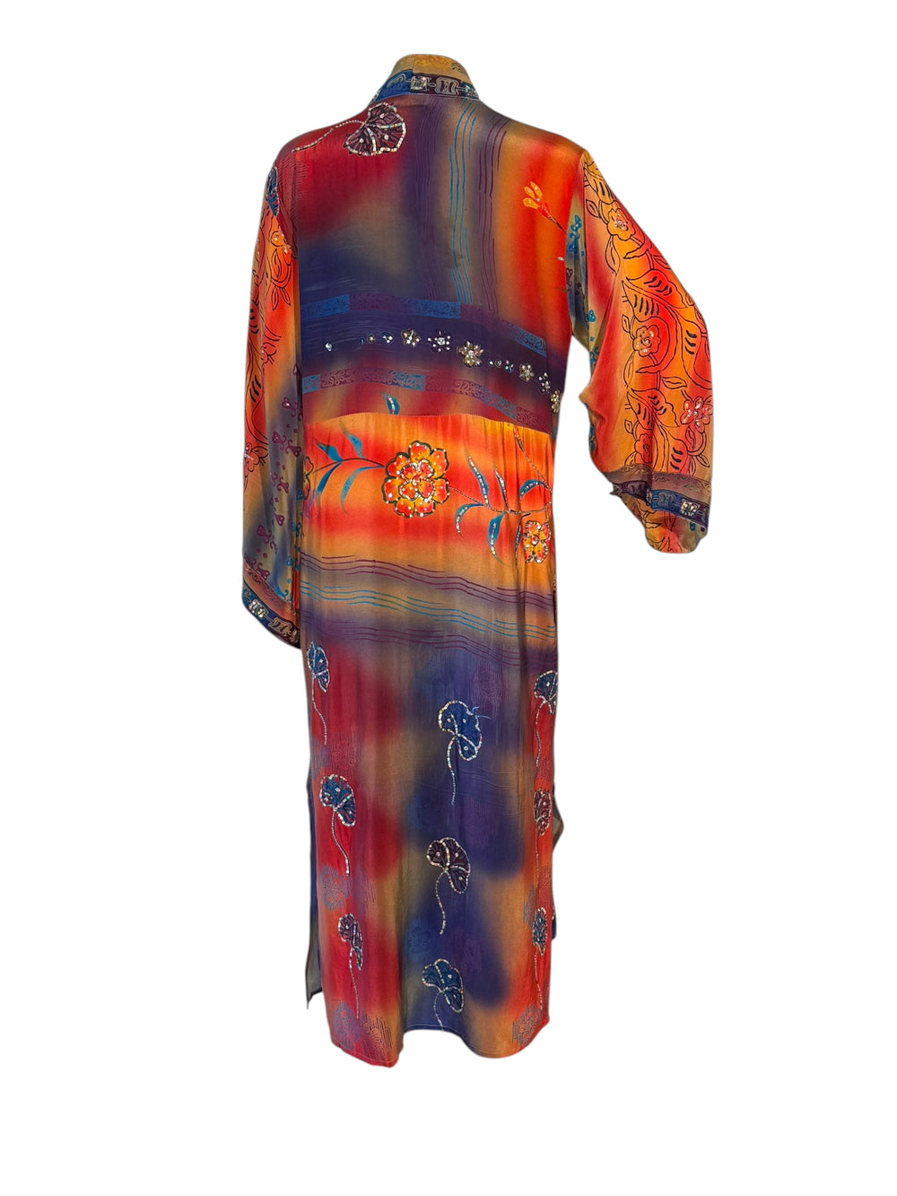 Back view of brightly colored vintage silk kimono in orange, red and blue with large flowers and colorful sequins and embroidery