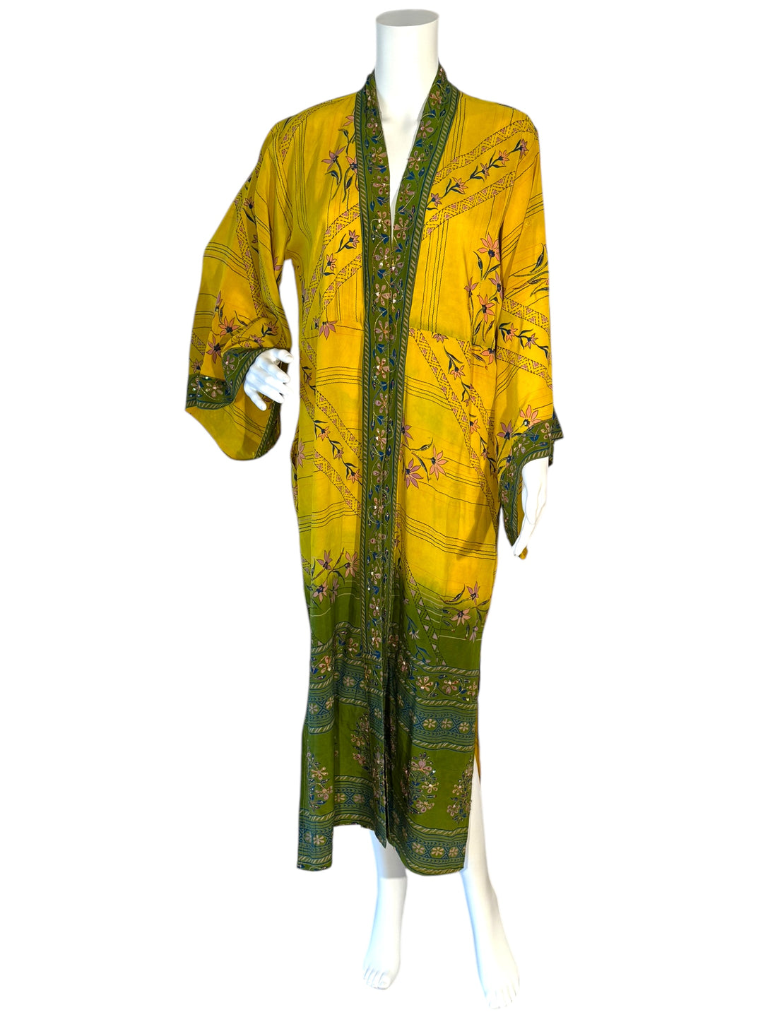 Front view of kimono in yellow vintage silk with green border prints and floral prints and gold embroidery