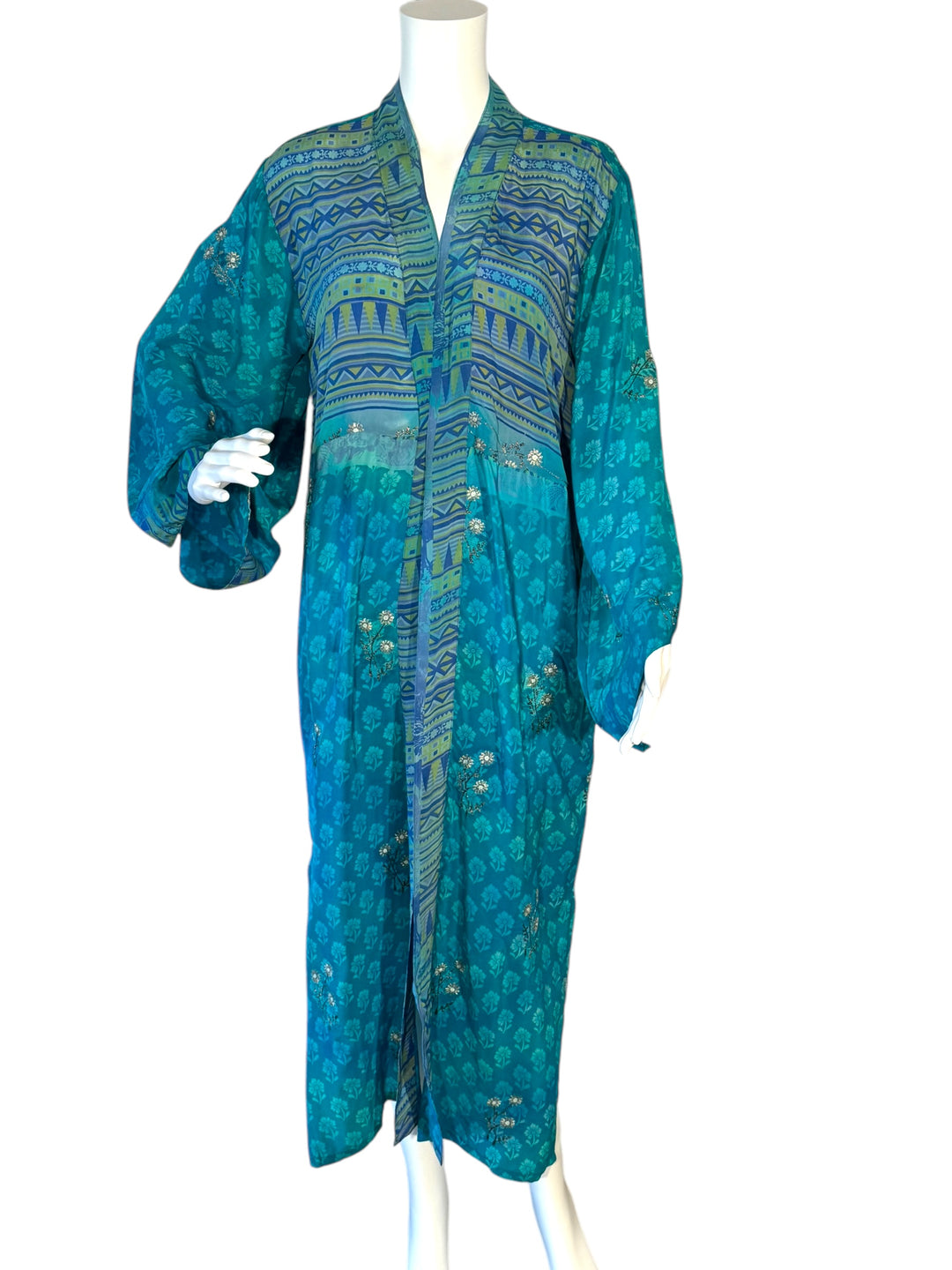 Front view of kimono in blue tonal small patterns of vintage silk floral with silver embroidery