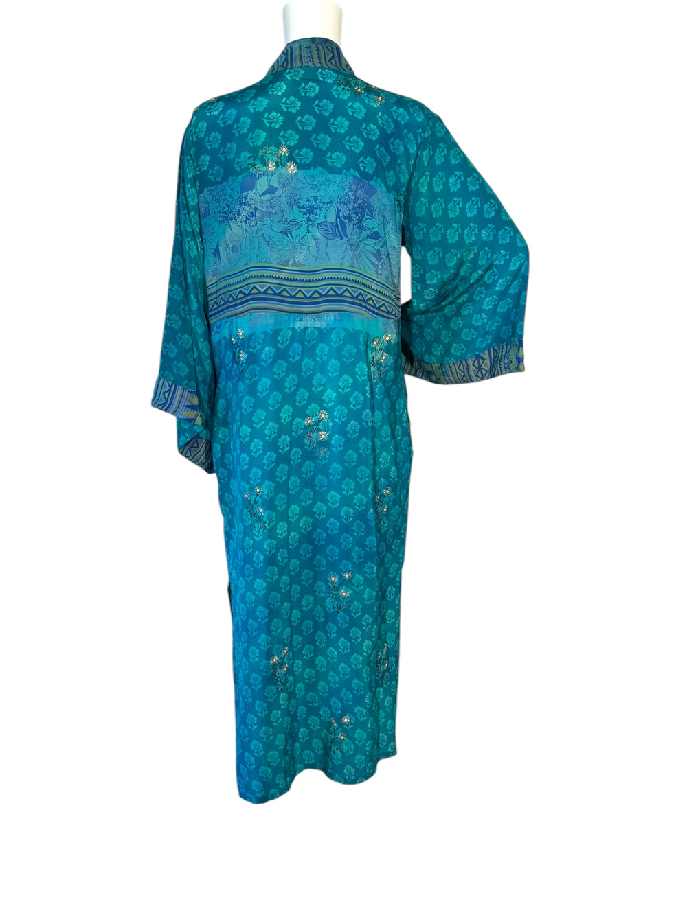 Back view of kimono in blue tonal small patterns of vintage silk floral with silver embroidery