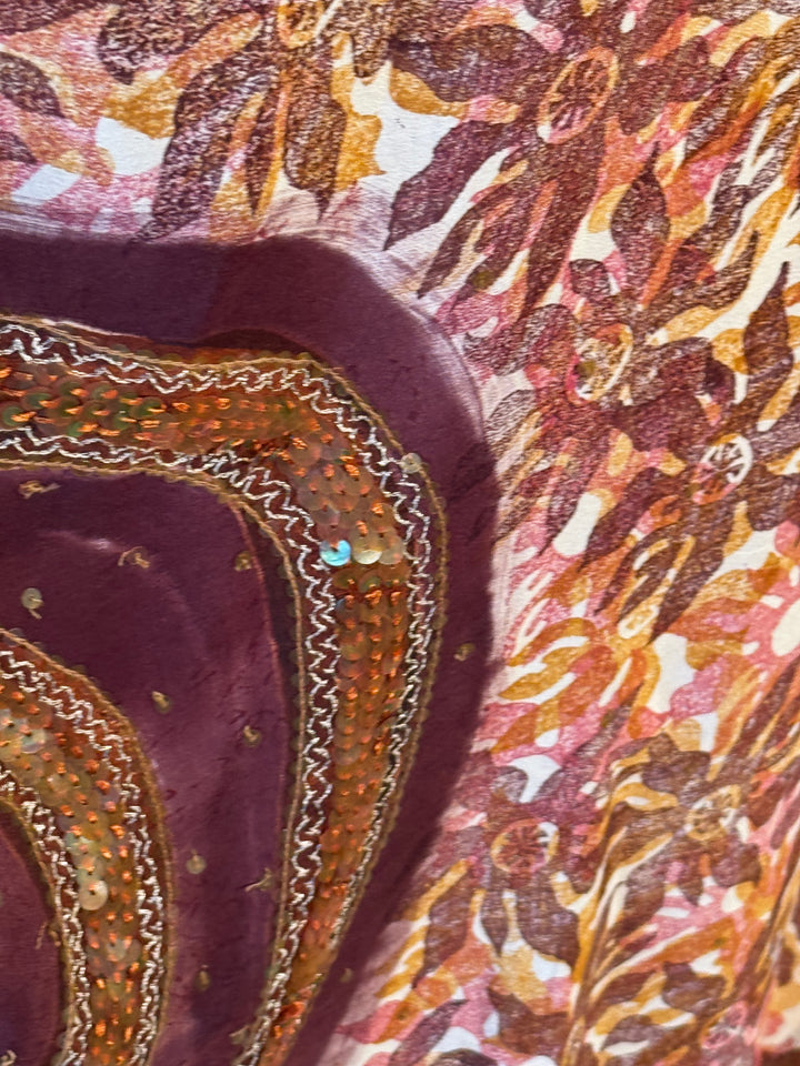 Richly patterned vintage silk with red, orange and gold and sequins