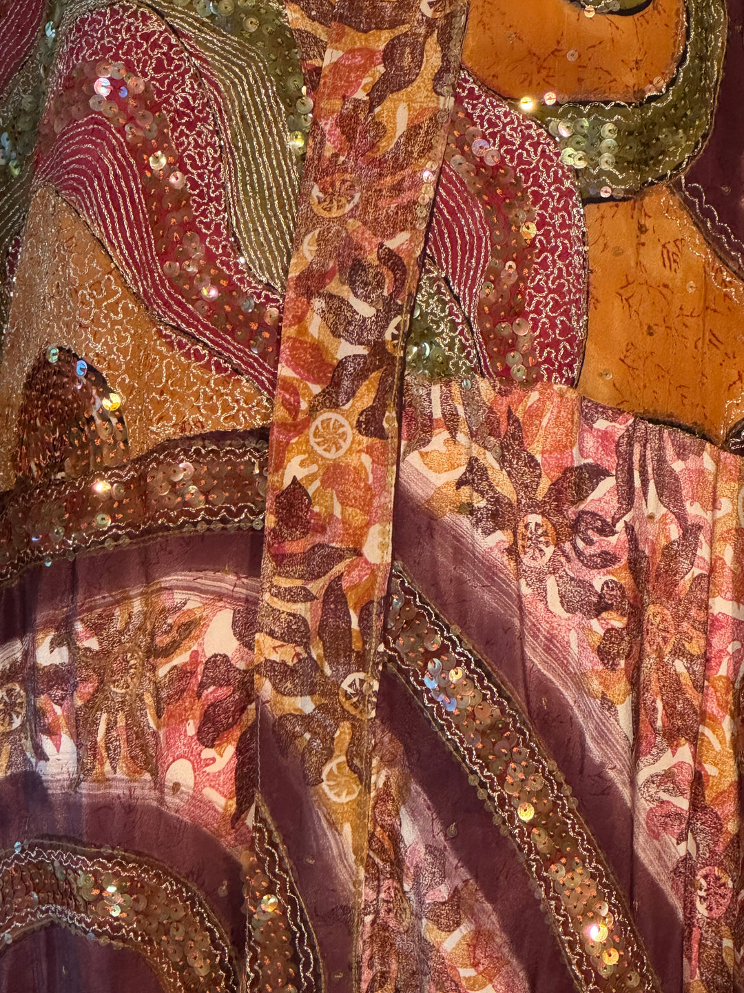 Richly patterned golden, red, yellow and embroidered vintage silk