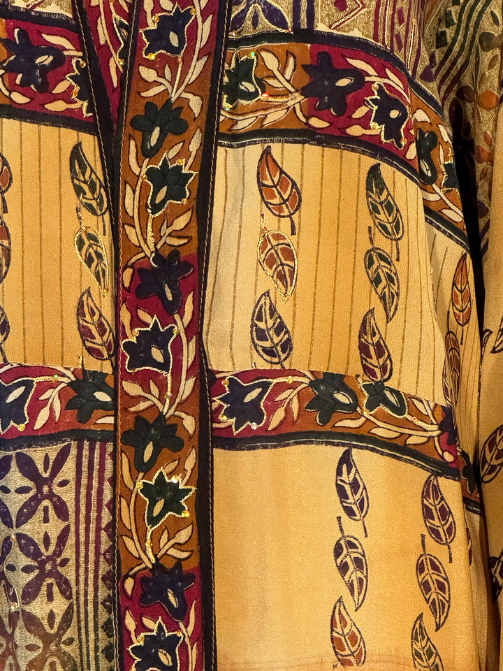 Yellow gold vintage silk with black and brown patterns and gold embroidery