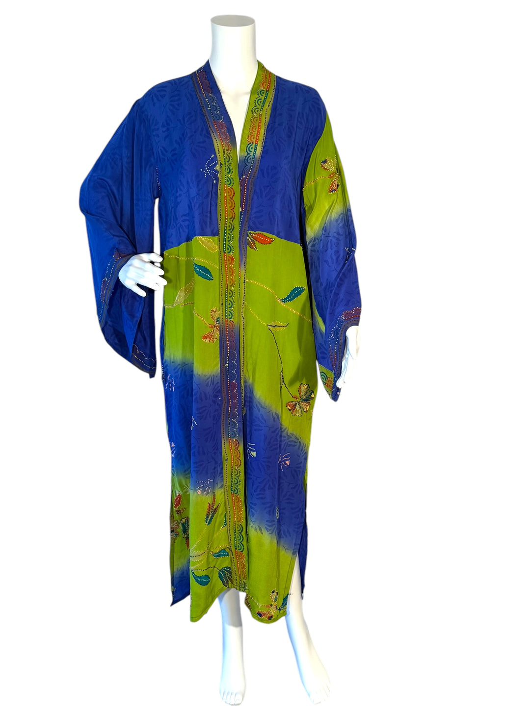 Front view of kimono in bright blue and green vintage silk with colorful embroidered flowers and faux jewels