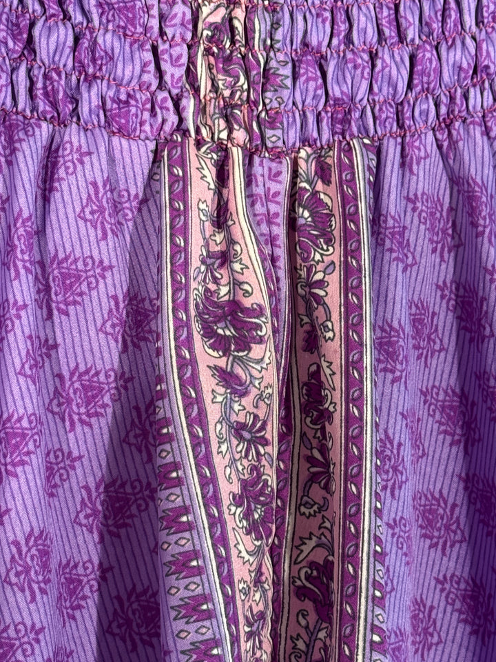 Close-up of a purple vintage silk blend with floral patterns