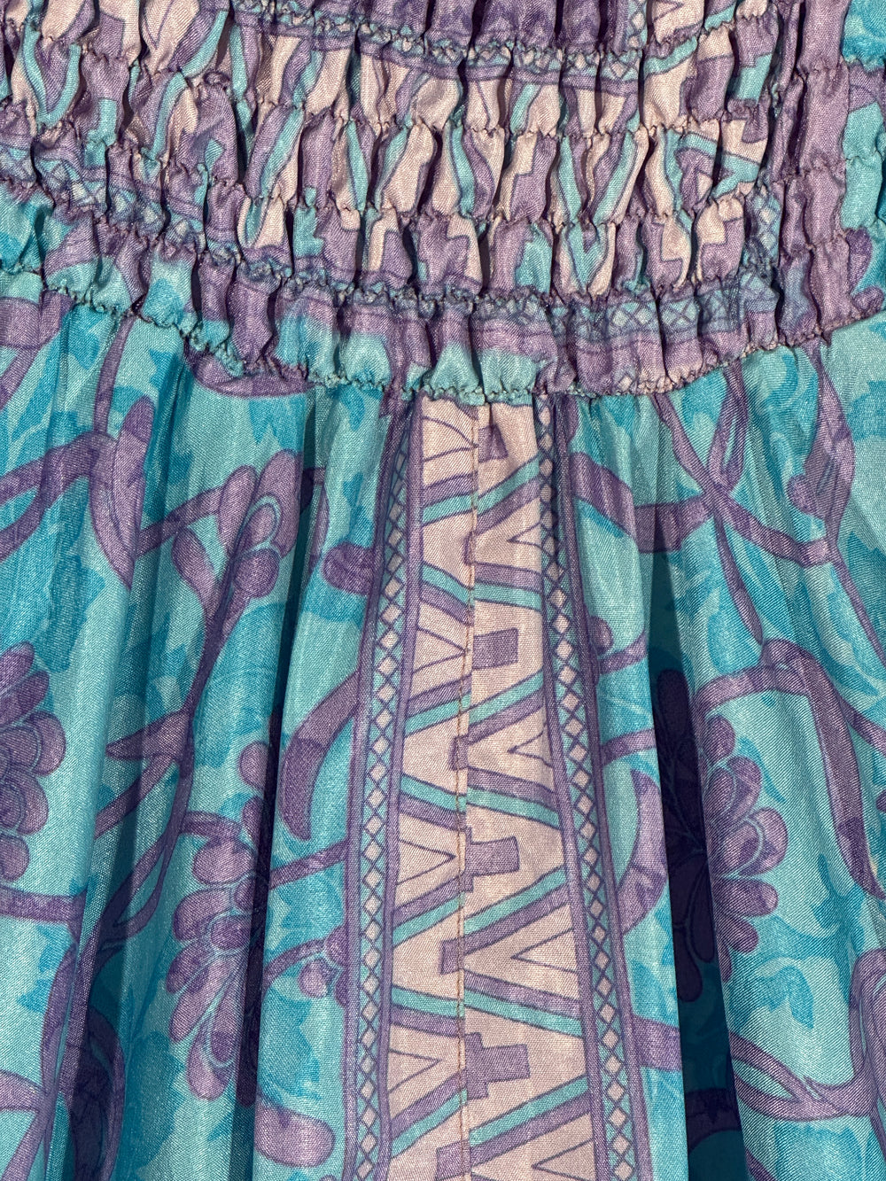 Close-up of  purple and blue patterns on recycled saree silk blend