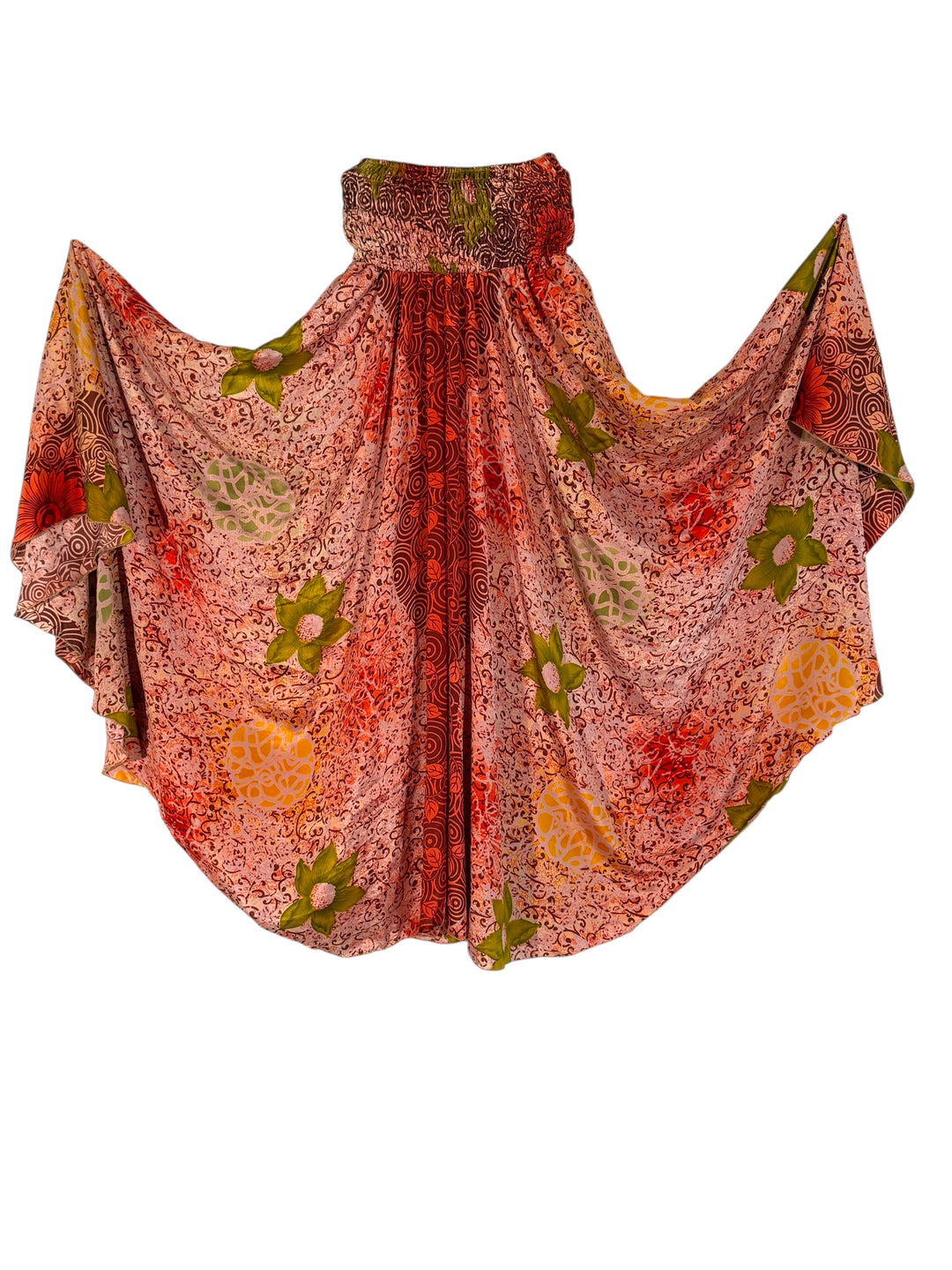 Colorful patterned palazzo pants in pink, red and green tropical print on a white background