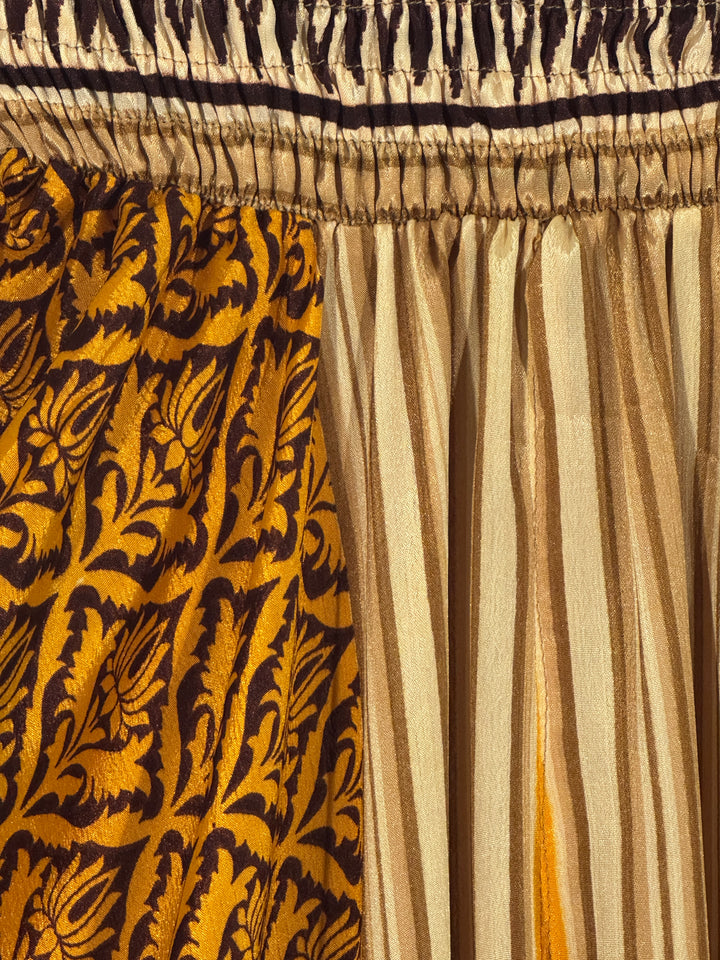 Close-up of a silk blend with intricate patterns in yellow and brown and tan