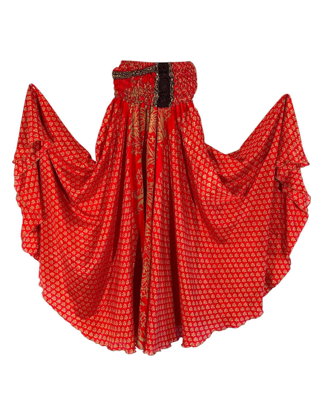 Red patterned palazzo pants with brown trim, on a white background