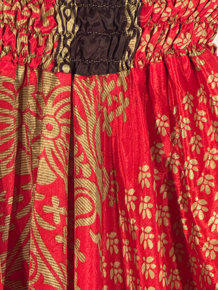 Red and gold silk blend fabric with brown trim