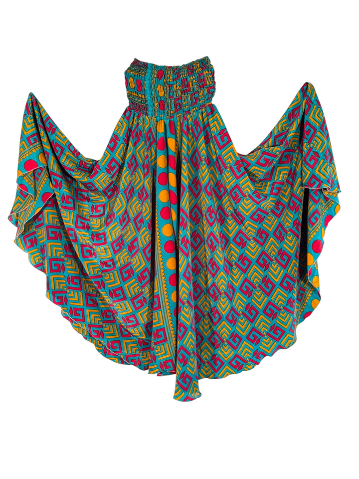 Colorful patterned silk blend palazzo pants in teal and red and yellow on a white background