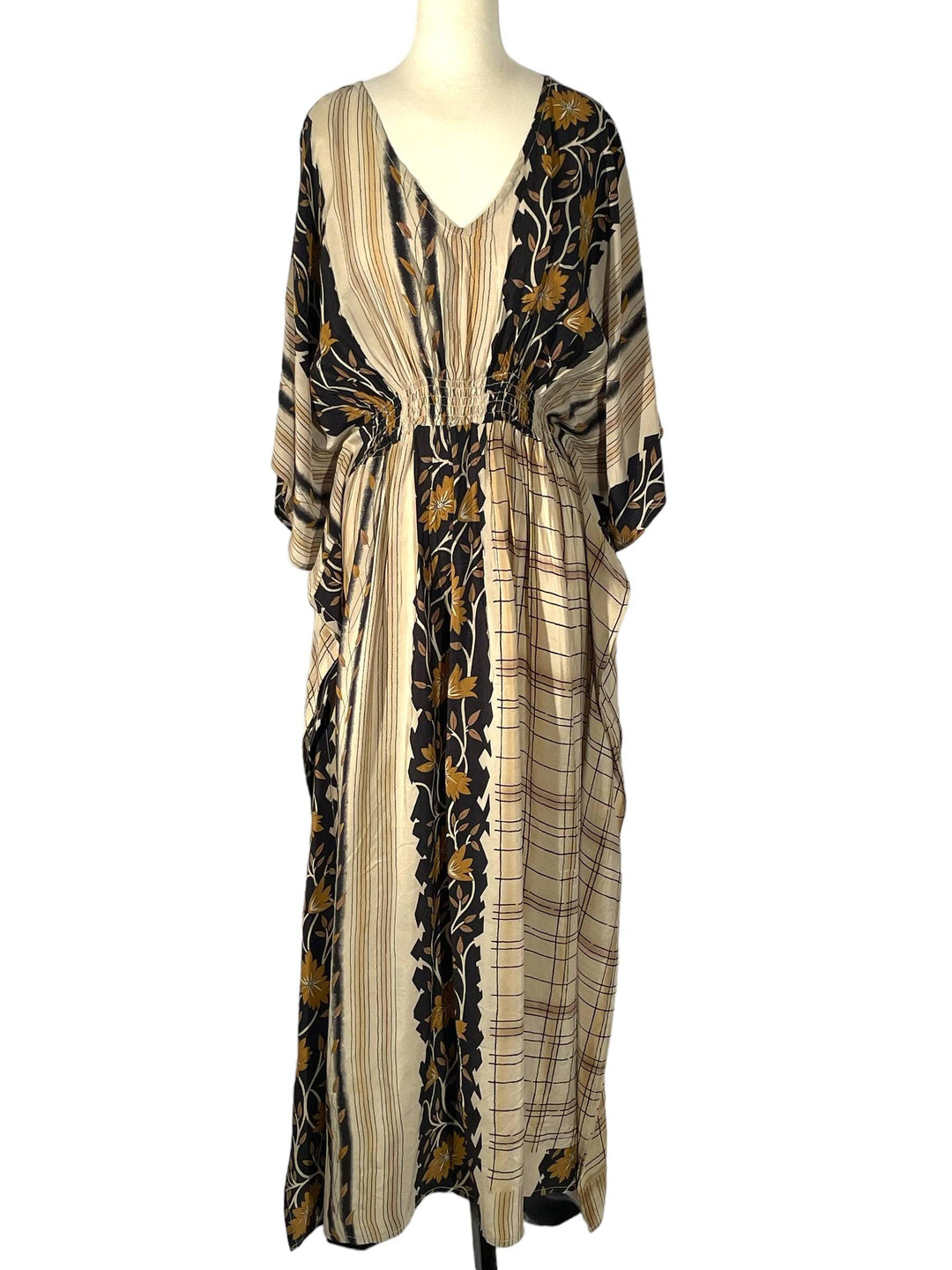 Sustainable cream silk kaftan - with black and gold patterns. V neck maxi length from vintage saree silk. Cold water washable. Easy to style and light and airy to wear.