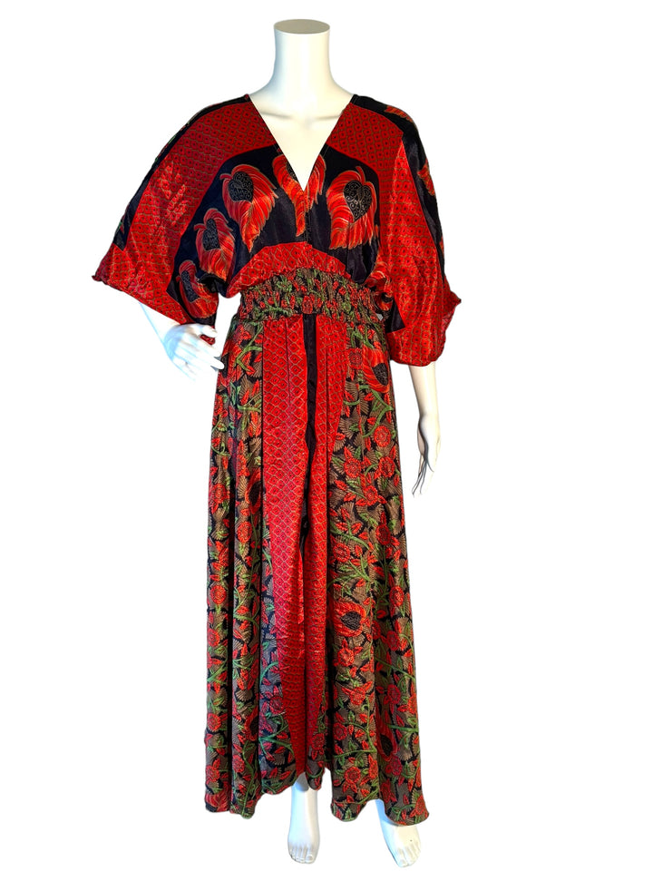 Red and navy  floral print boho silk blend dress.  Midi length with V neck front and back and tassel tie.  Flattering elastic gathering under bust.