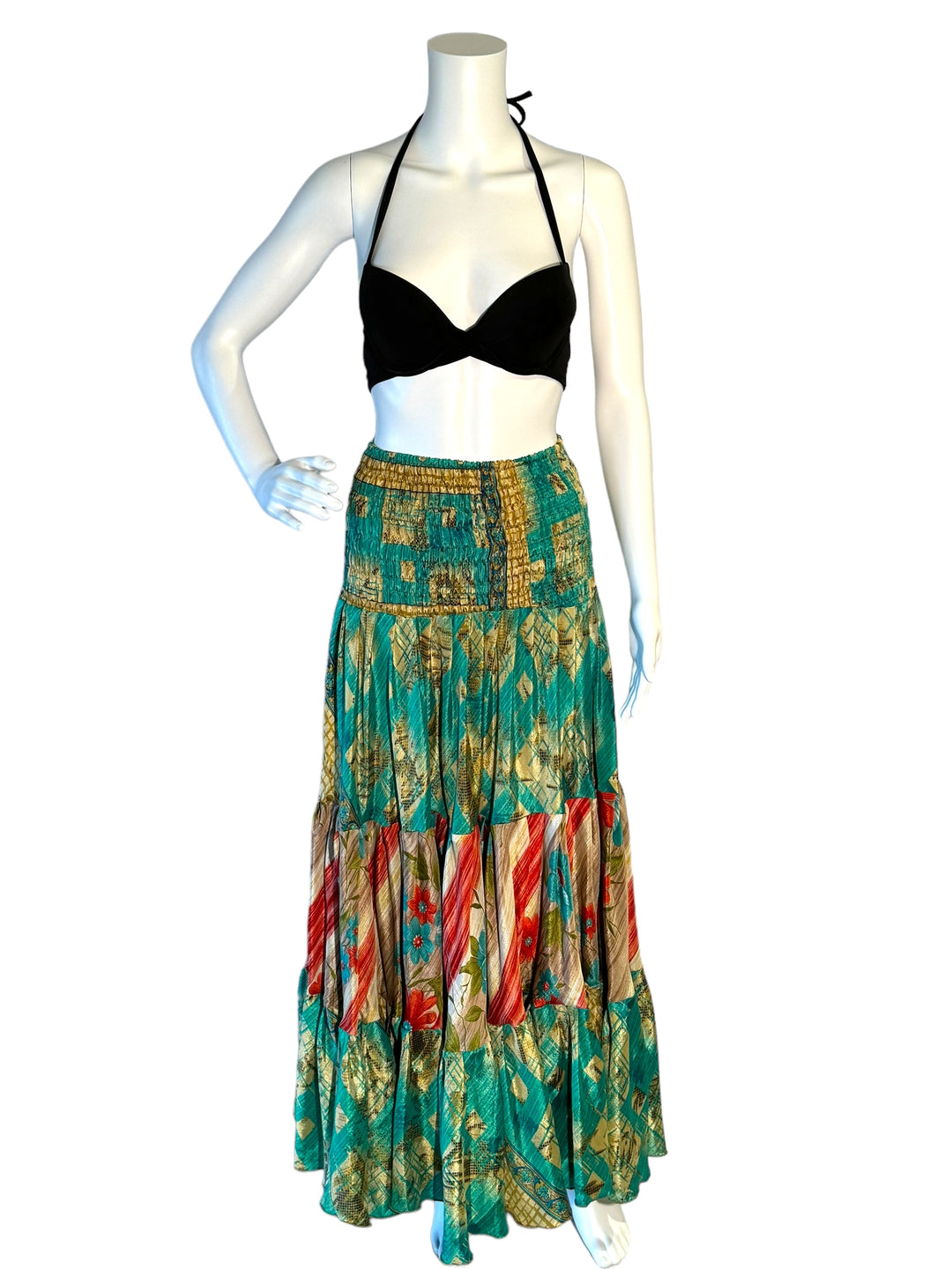 Green multi print maxi skirt in gathered tiers.  Wide elastic top can become a strapless dress.  Recycled Indian silks.