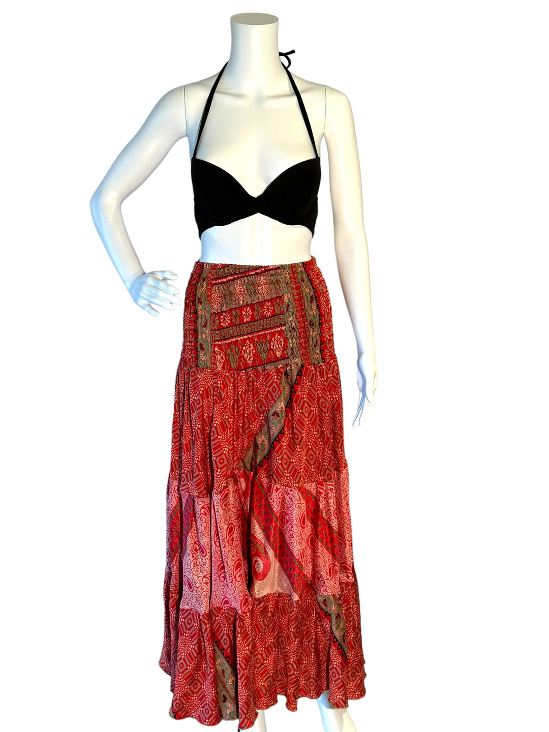 Red multi print maxi skirt in gathered tiers.  Wide elastic top can become a strapless dress.  Recycled Indian silks.