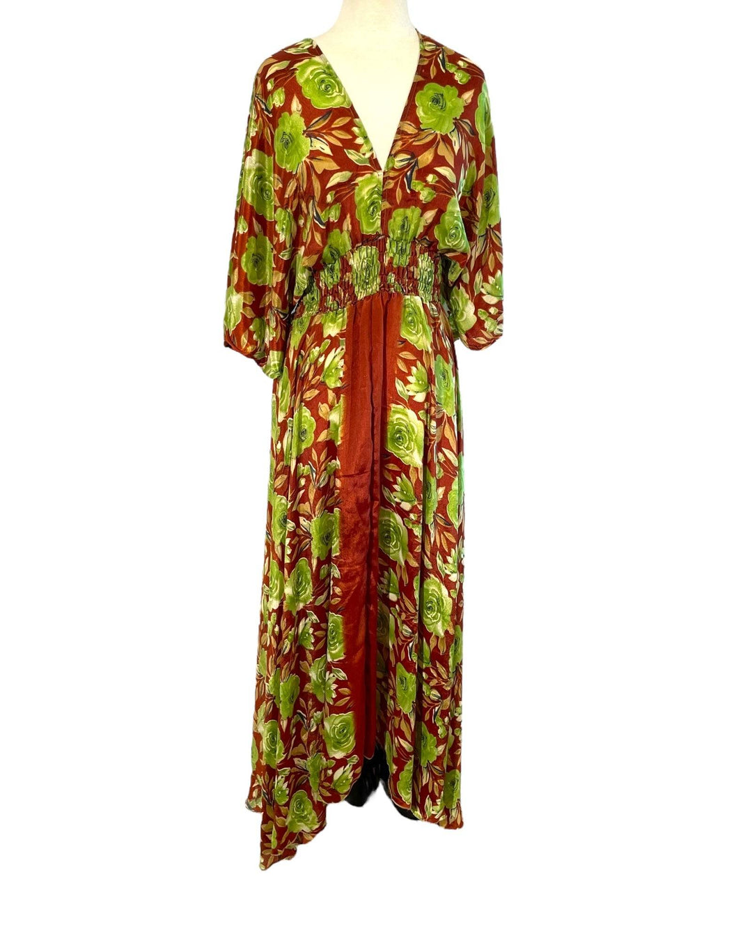 Brown and green floral print boho silk blend dress.  Midi length with V neck front and back and tassel tie.  Flattering elastic gathering under bust.