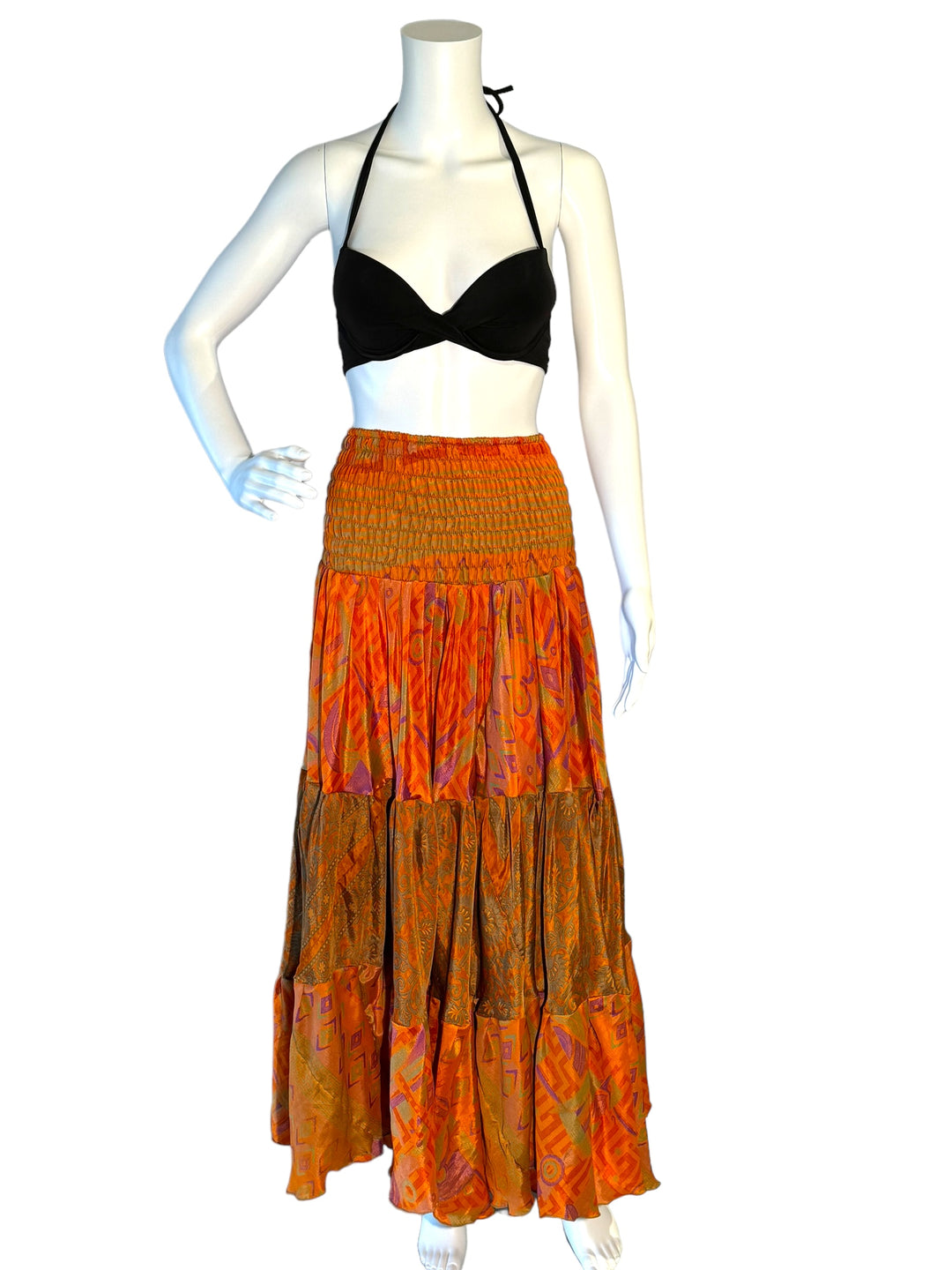 Orange multi print maxi skirt in gathered tiers.  Wide elastic top can become a strapless dress.  Recycled Indian silks.