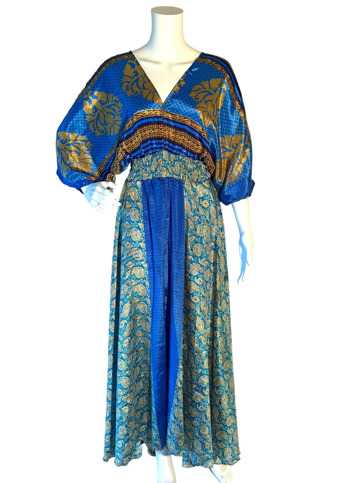 Blue and gold paisley print boho silk blend dress.  Midi length with V neck front and back and tassel tie.  Flattering elastic gathering under bust.