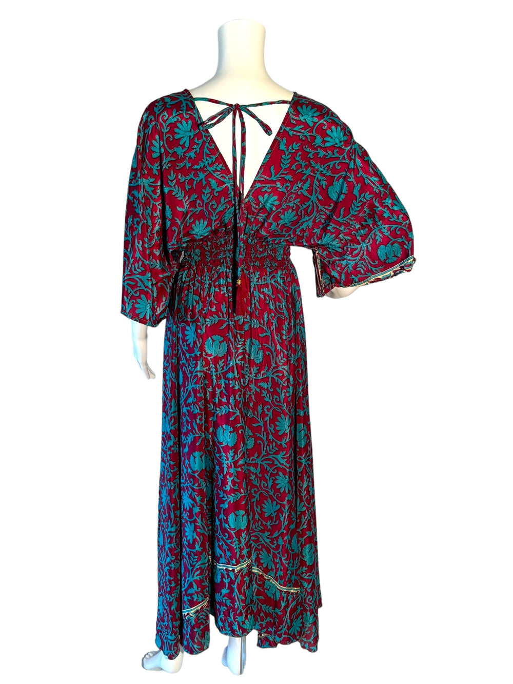 Reverse view of deep red and bright blue Boho dress in sustainable silk blend.