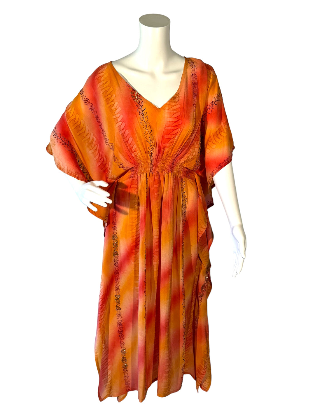 Sustainable peach & pink silk kaftan with vines of print and sequins. V neck maxi length from vintage saree silk. Cold water washable. Easy to style and light and airy to wear.