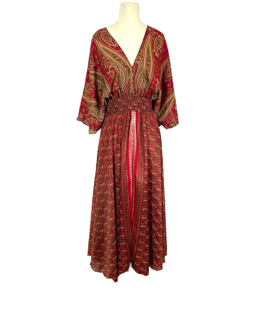 Red and gold paisley print boho silk blend dress.  Midi length with V neck front and back and tassel tie.  Flattering elastic gathering under bust.