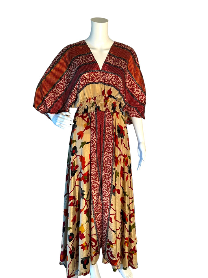 Cream with red floral print boho silk blend dress.  Midi length with V neck front and back and tassel tie.  Flattering elastic gathering under bust.