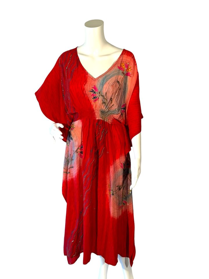 Sustainable red silk kaftan - filled with swaths of embroidered and sequins florals. V neck maxi length from vintage saree silk. Cold water washable. Easy to style and light and airy to wear.