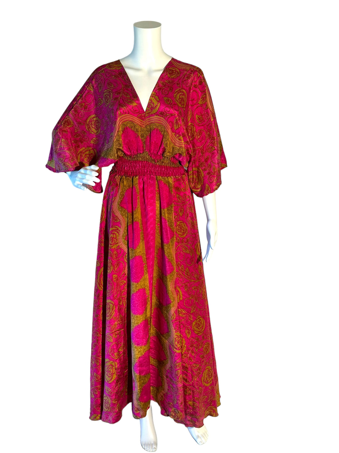 Bright pink and gold rose print boho silk blend dress.  Midi length with V neck front and back and tassel tie.  Flattering elastic gathering under bust.