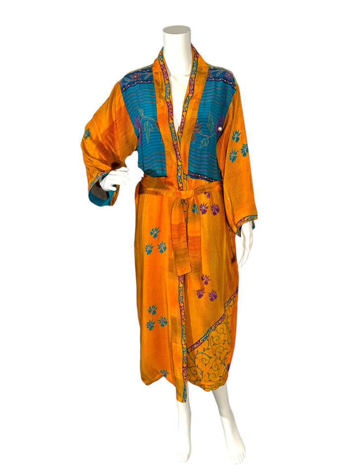 Outside front view of reversible kimono in orange vintage silk with green floral and vine pattern and sequined embroidery