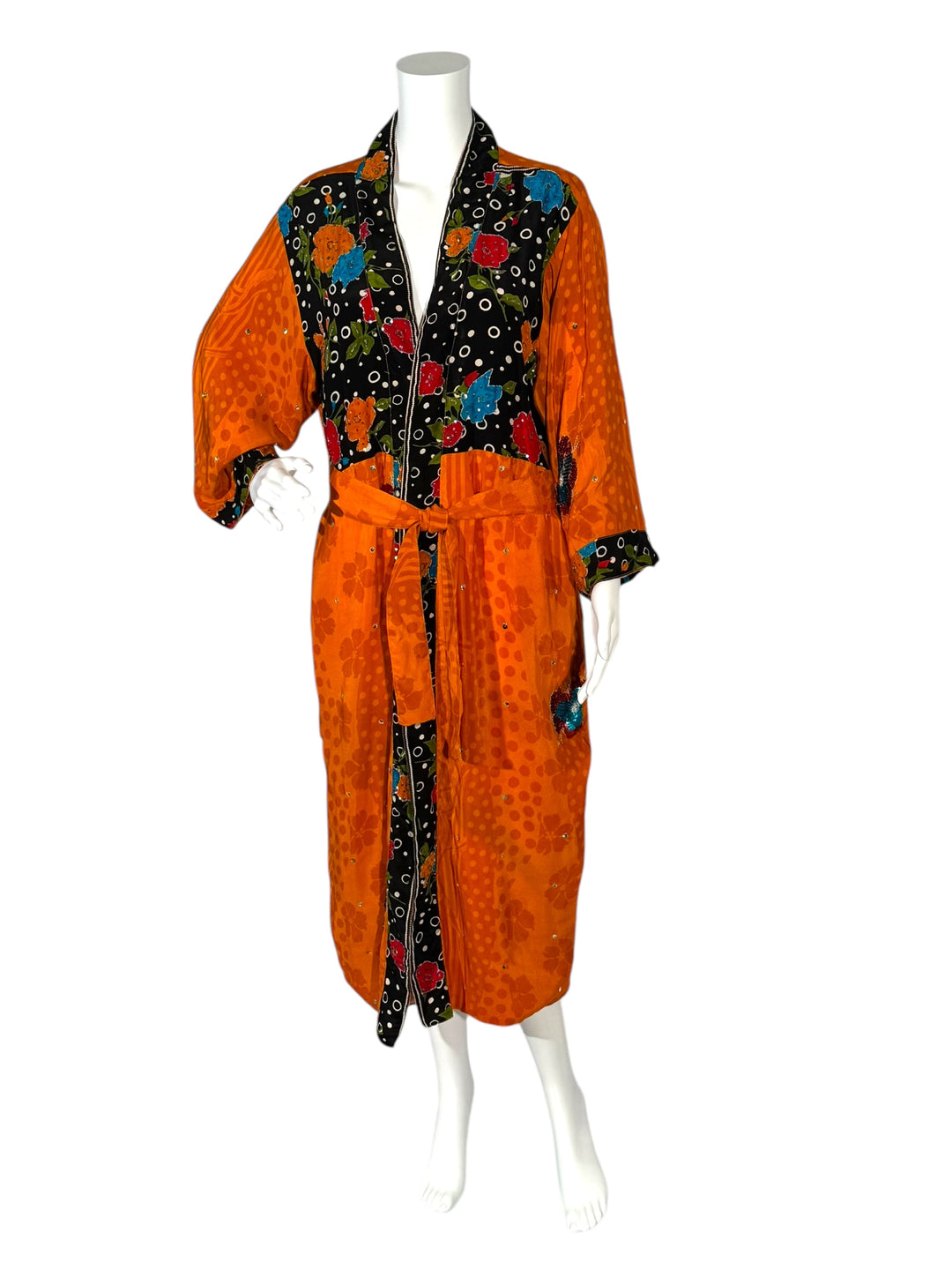 Outside front view of reversible kimono in orange vintage silk with brilliant sequins flowers and black borders