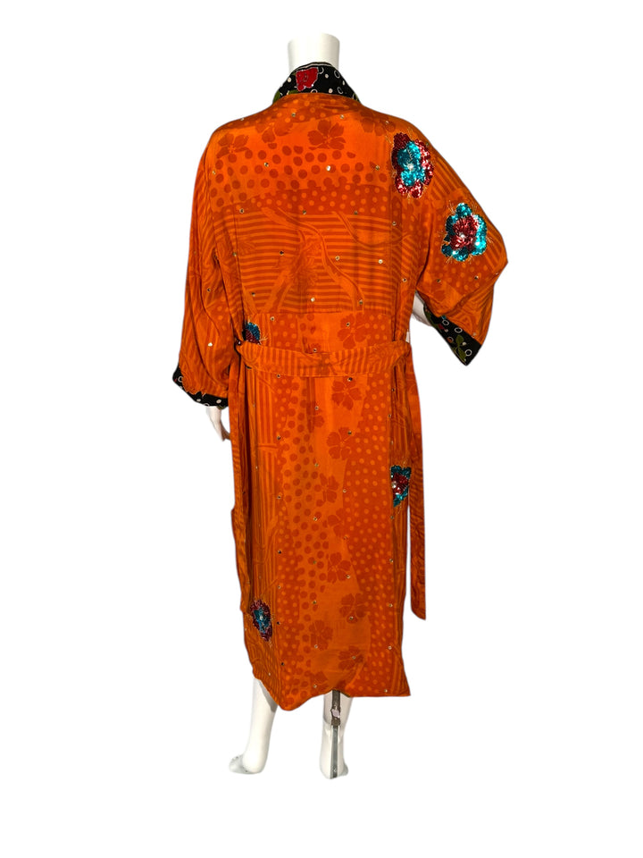 Outside back view of reversible kimono in orange vintage silk with brilliant sequins flowers and black borders