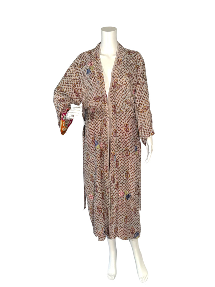 Outside front view of vintage silk reversible kimono in tan paisley with pink and blue embroidered flowers without tie belt