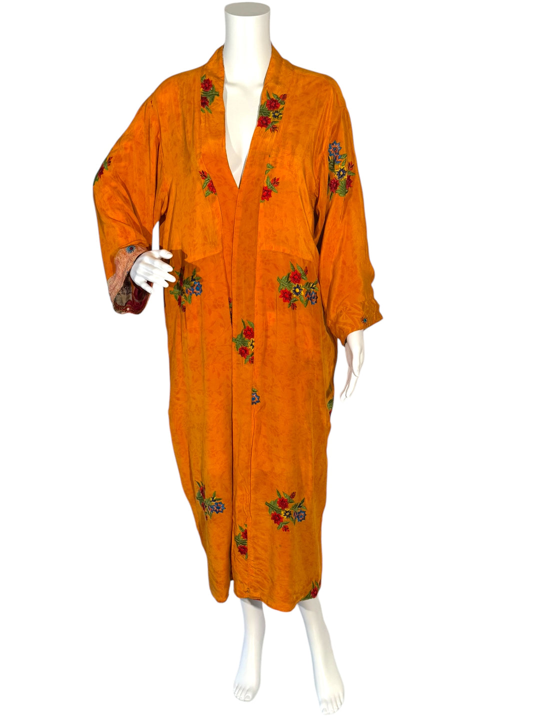 Inside front view of reversible kimono in orange vintage silk with large embroidered multicolor flowers