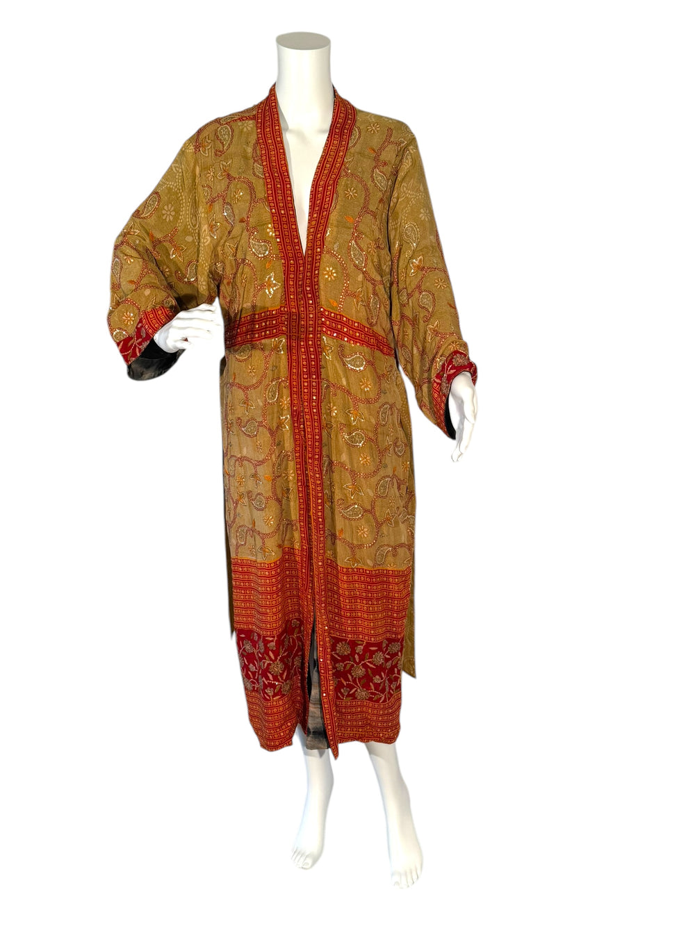 Outside front view of reversible kimono in tan with rust paisley and sequined embroidery and rust border areas without tie belt