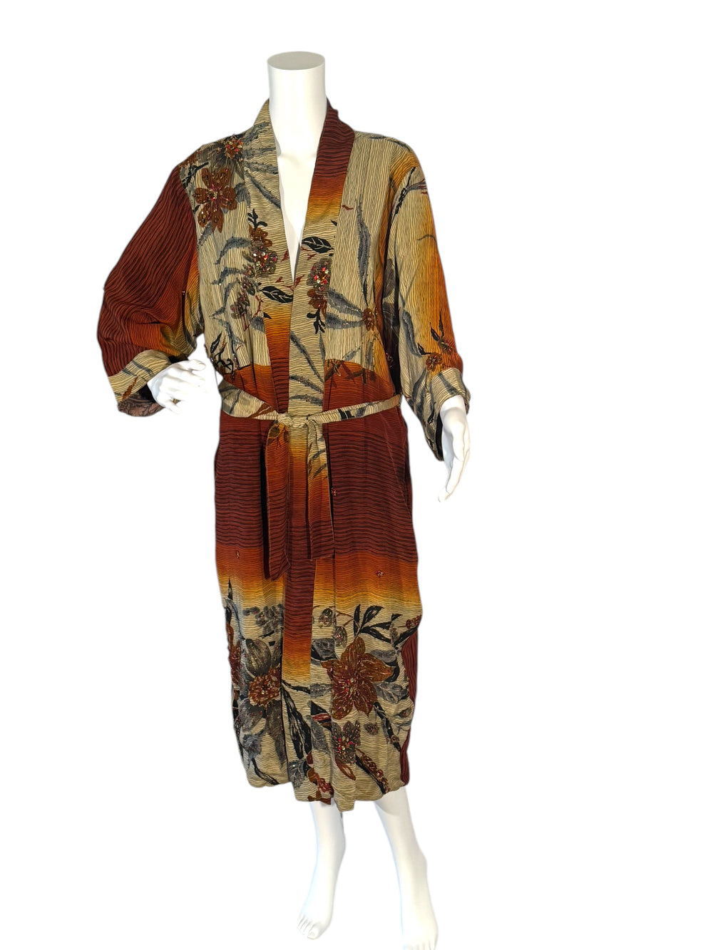 Outside front view of reversible kimono in beige rust and black bamboo print with embroidery