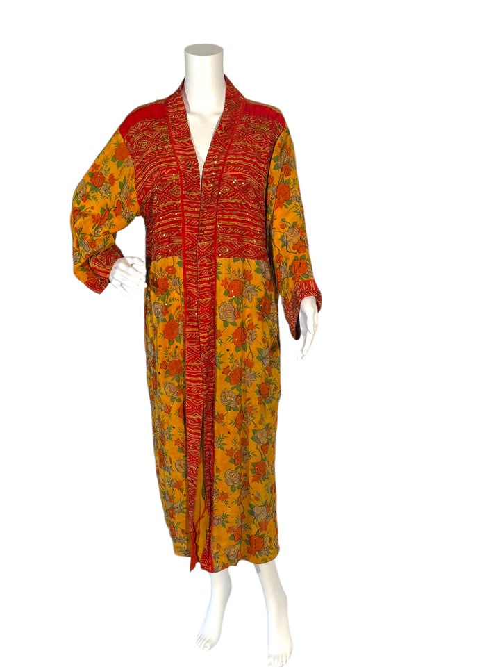 Outside front view of reversible kimono in yellow and orange flowered vintage silk with gold embroidery without tie belt