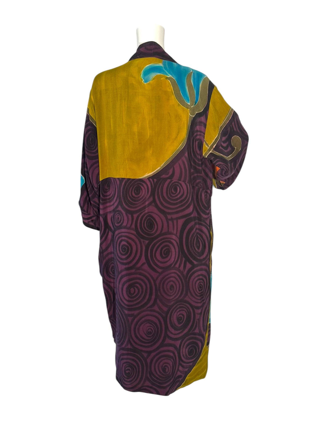 Outside back view of reversible vintage silk kimono in bright purple  and gold graphic print 