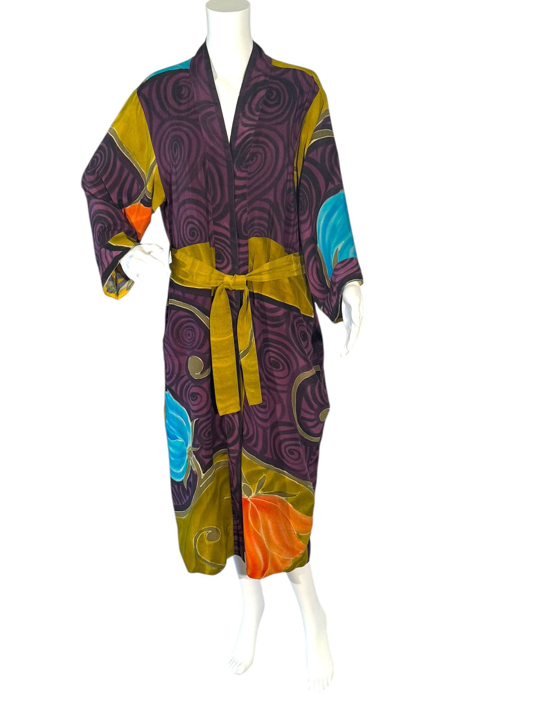 Outside front view of reversible vintage silk kimono in bright purple  and gold graphic print 