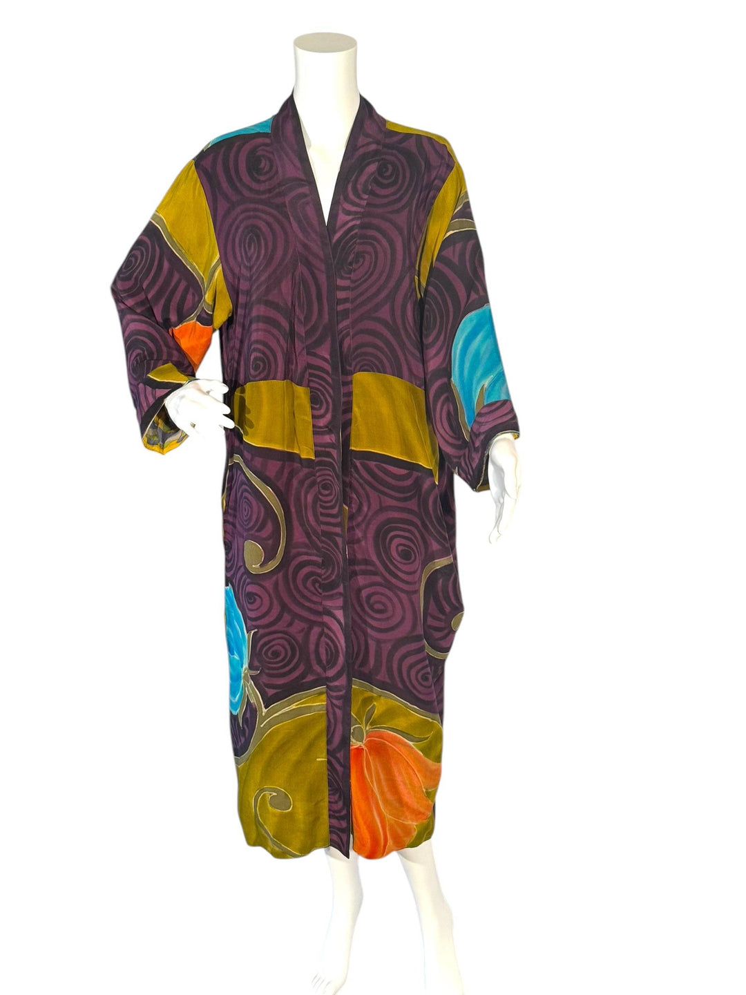 Outside front view of reversible vintage silk kimono in bright purple  and gold graphic print without tie belt