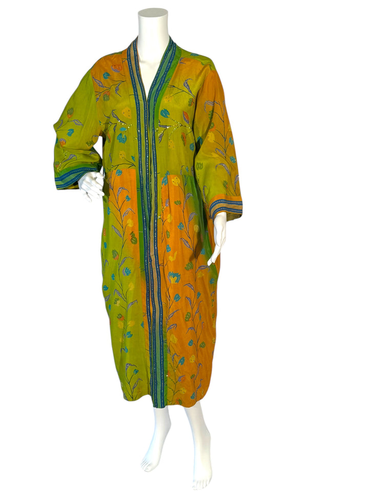 Back outside view of reversible kimono in green and orange floral with metallic embroidery without tie belt