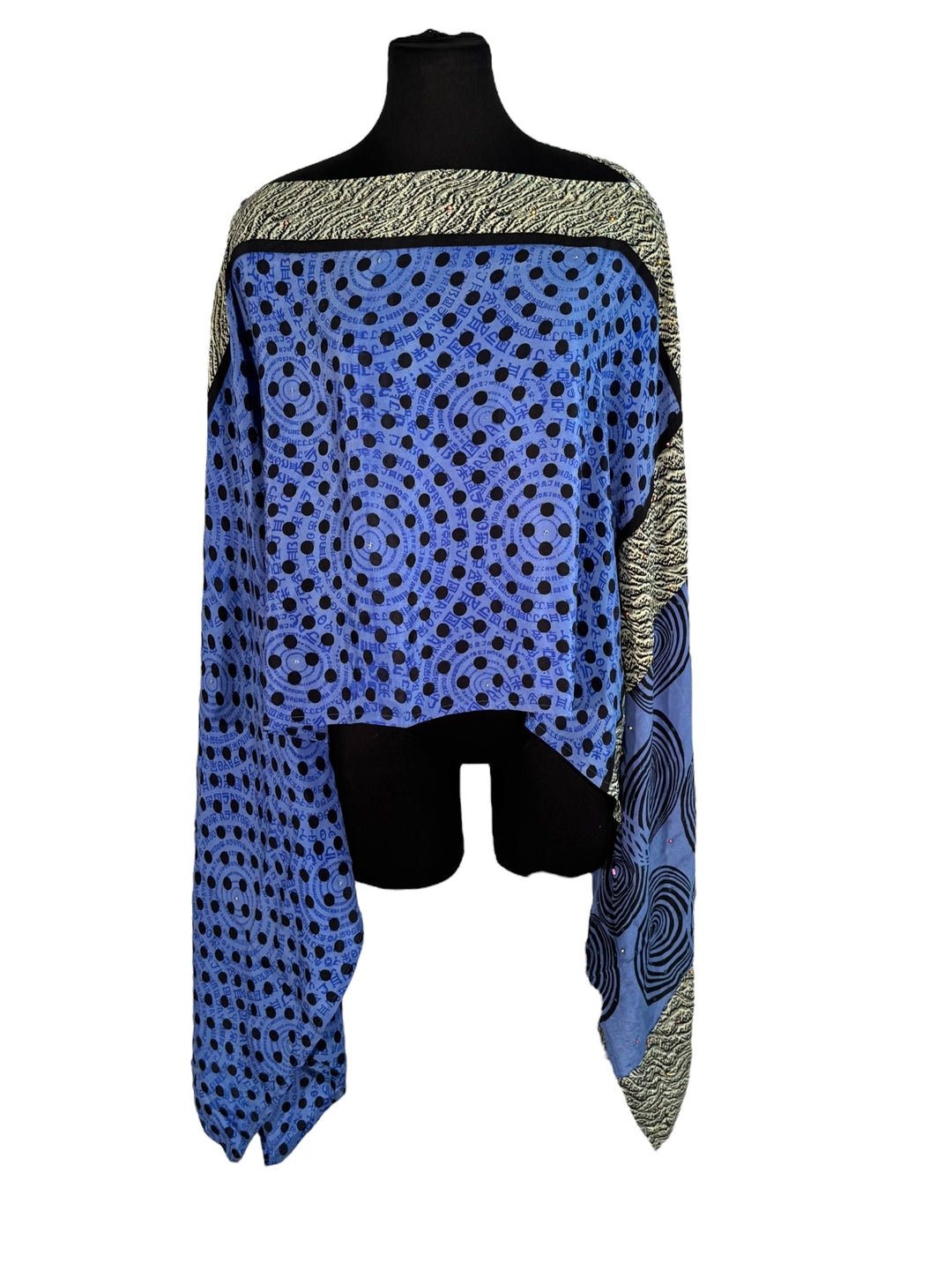 Sideways view of vintage silk Willow Wrap in Blue, Black and Cream graphic patter with small sequins