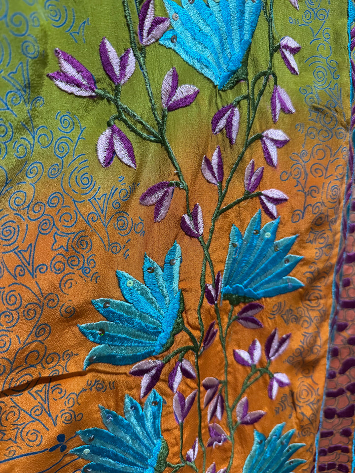 Close view of vintage silk Willow Wrap in Orange and Blue, Black  with extensive floral embroidery 