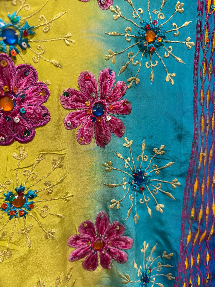 Close detail view of vintage silk Willow Wrap in Blue and yellow  with extensive floral embroidery