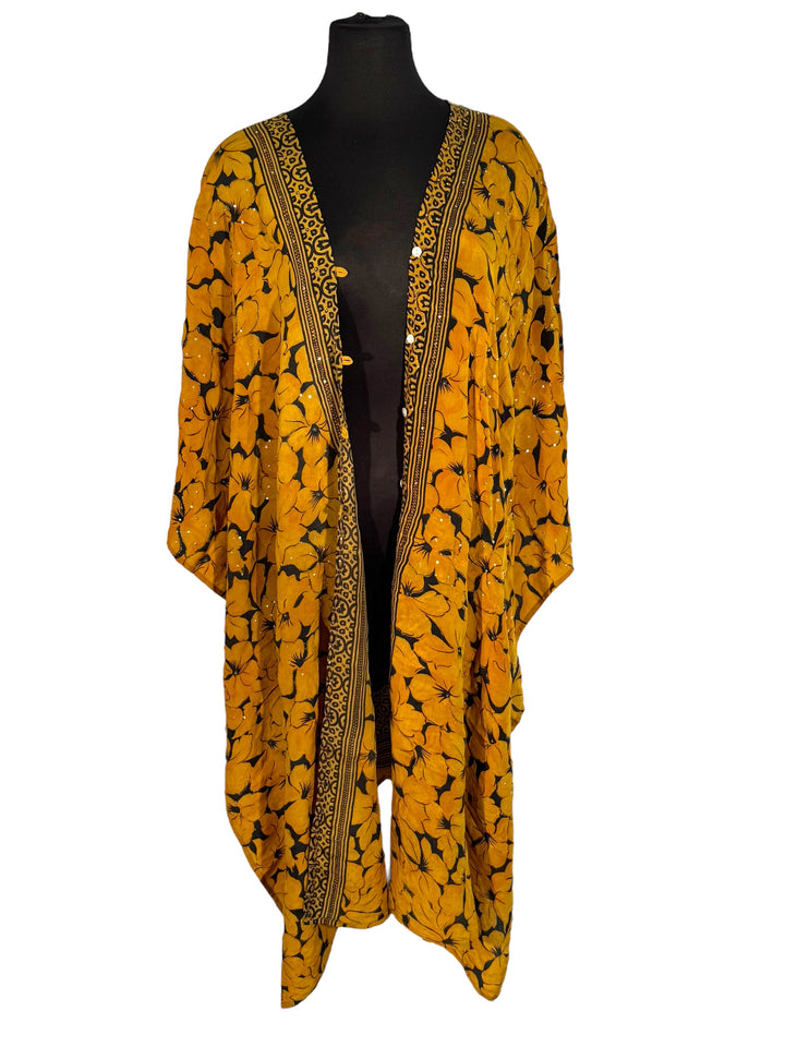 Front view of vintage silk Willow Wrap in gold and black  graphic and floral print with sequins