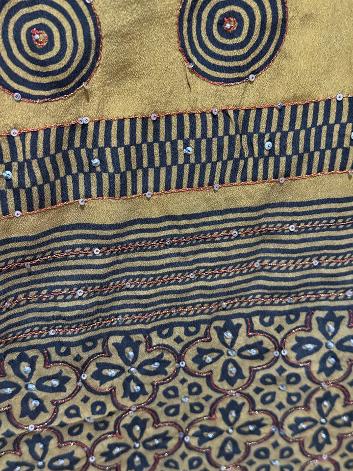 Detail view of vintage silk Willow Wrap in gold and black  graphic and floral print with sequins