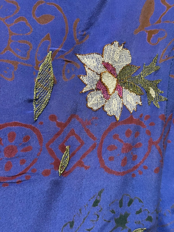 Detail view of vintage silk Willow Wrap in rich blue with red and embroidered flowers