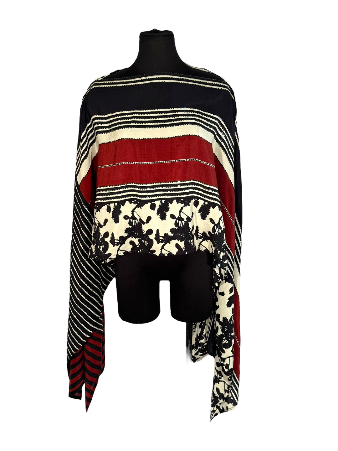 Sideways view of vintage silk Willow Wrap in Black, cream and red with floral and stripe print and black sequins