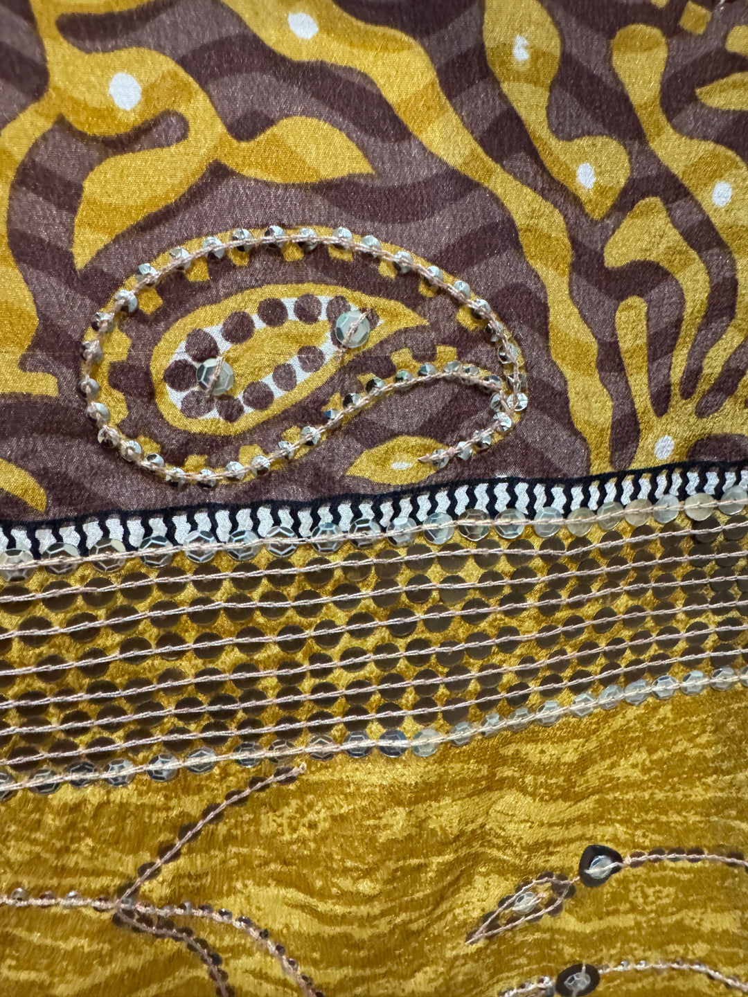 Detail view of vintage silk Willow Wrap in gold vine and paisley print with emboidery and sequins