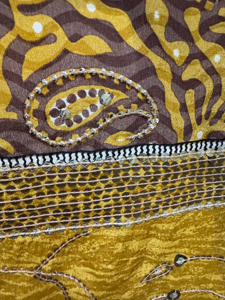 Detail view of vintage silk Willow Wrap in gold vine and paisley print with emboidery and sequins